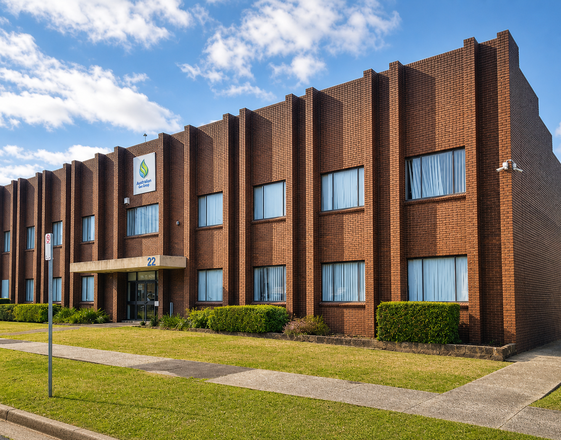 The Breathe Fresh production facility in Melbourne. Two-storey red-brick building with the company logo above the front entrance.