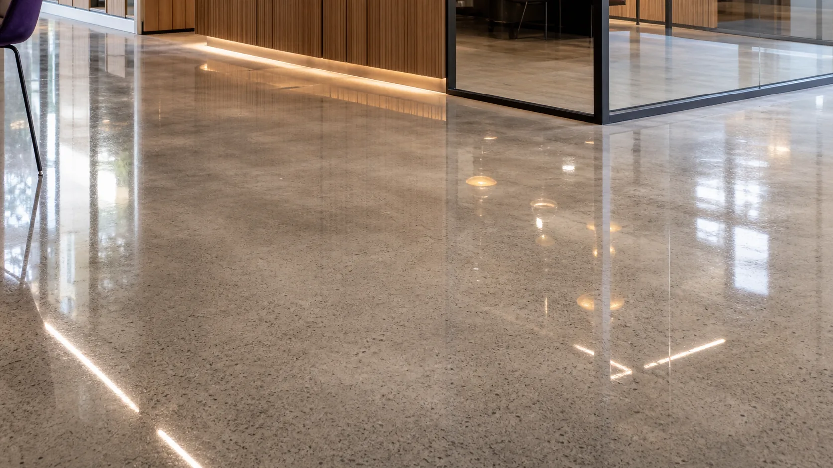 Polished concrete floor with a high-gloss, reflective finish